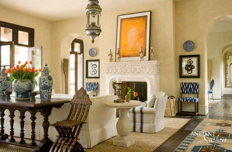 Antique reclaimed limestone mantel in a refined trade project interior